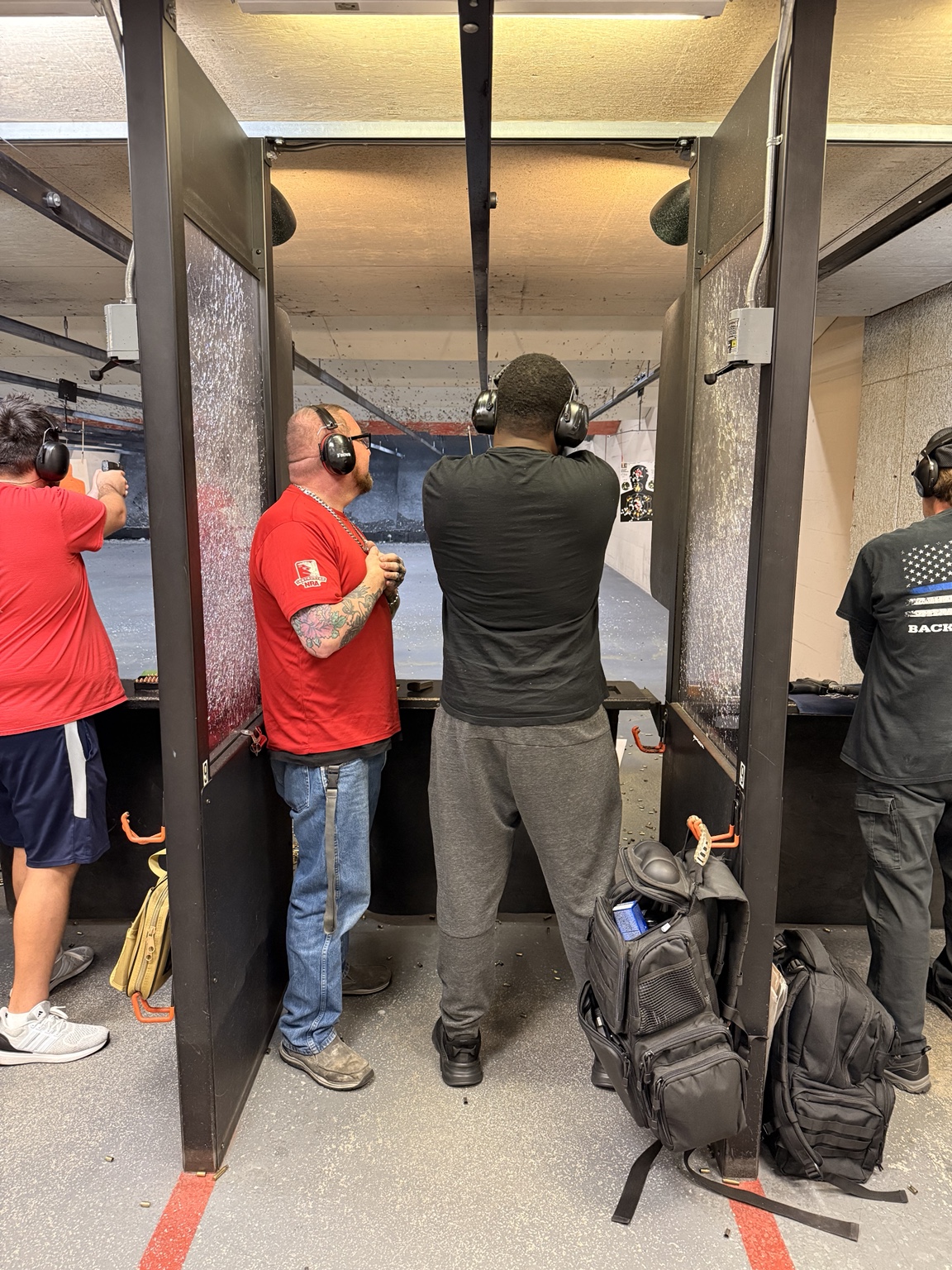 Instructor Jay working with a student at the range